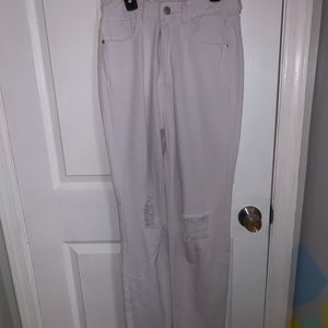 wide legged white jeans with rips